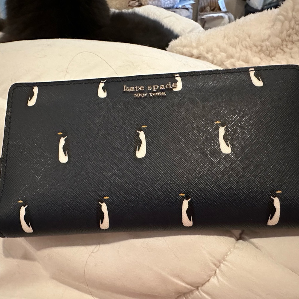 Kate Spade in like new condition. Navy blue with penguins.